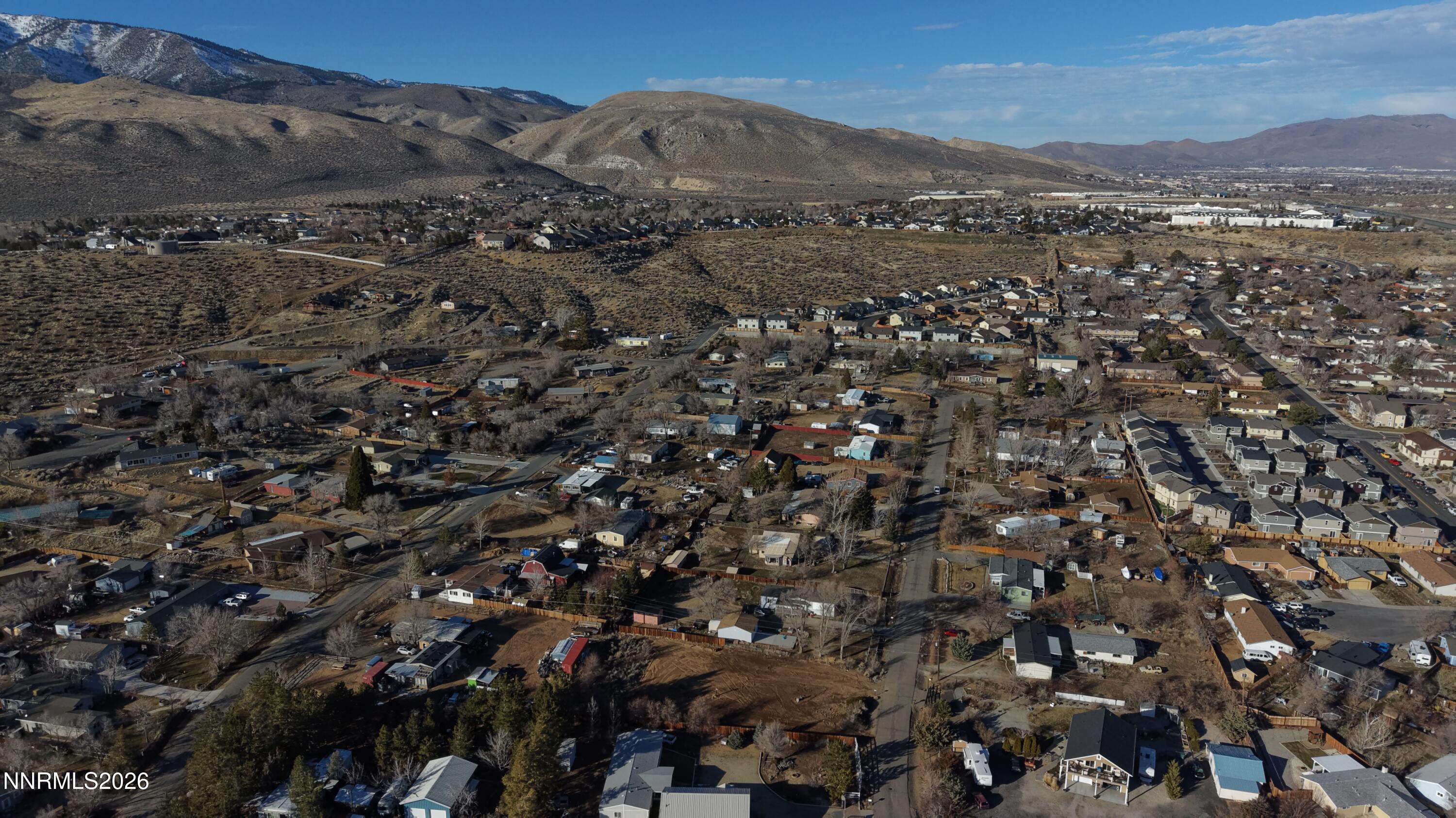 3455 Carnelian Way Carson City, NV 89705 - Photo 5 of 12 an aerial view of town with residential houses and mountain view