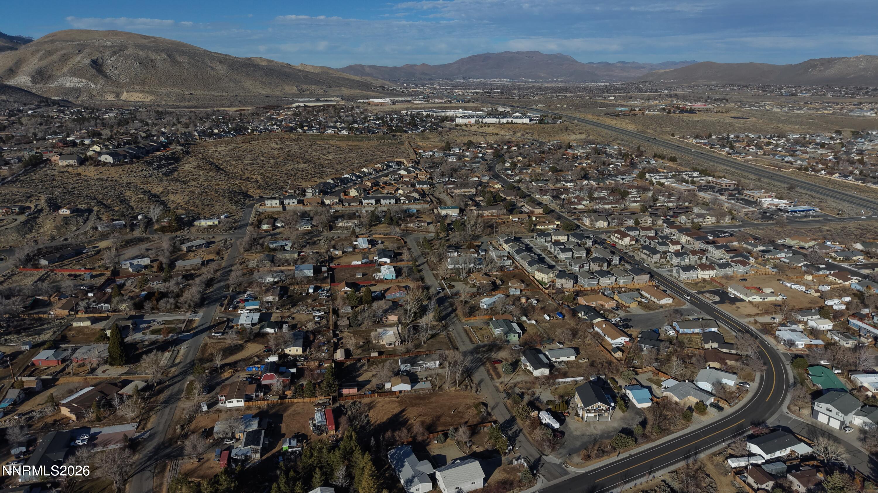 3455 Carnelian Way Carson City, NV 89705 - Photo 6 of 12 an aerial view of house with yard and mountain view in back