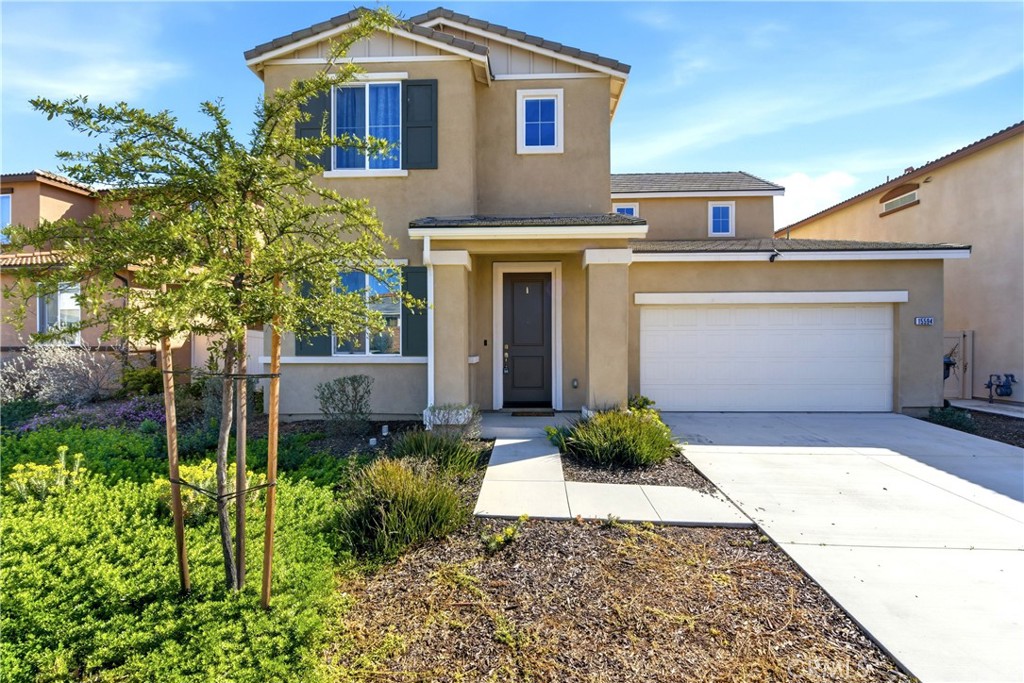 15594 Raptor Road Moreno Valley, CA 92551 - Photo 2 of 53 a front view of a house with garden