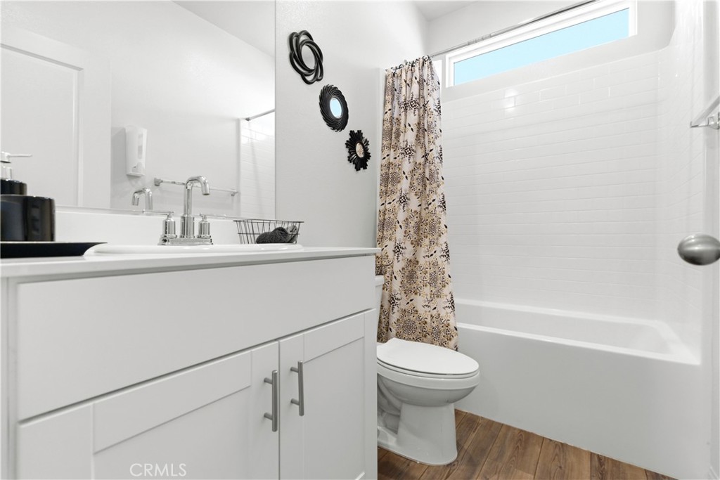 15594 Raptor Road Moreno Valley, CA 92551 - Photo 32 of 53 a bathroom with a sink a toilet and a bathtub