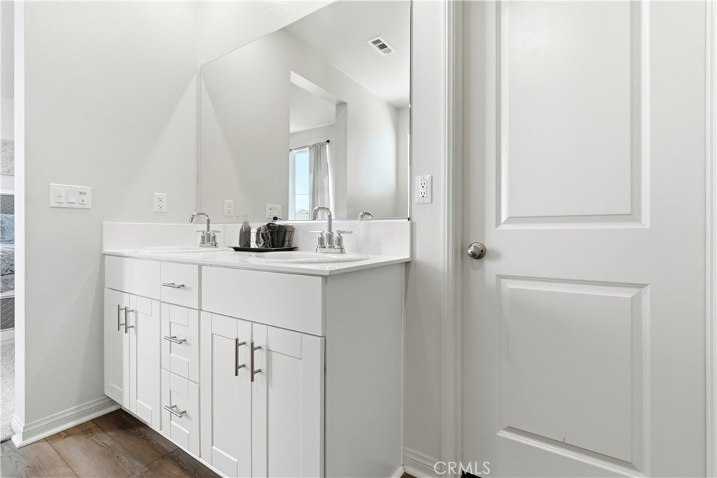 15594 Raptor Road Moreno Valley, CA 92551 - Photo 42 of 53 a bathroom with a sink and a mirror