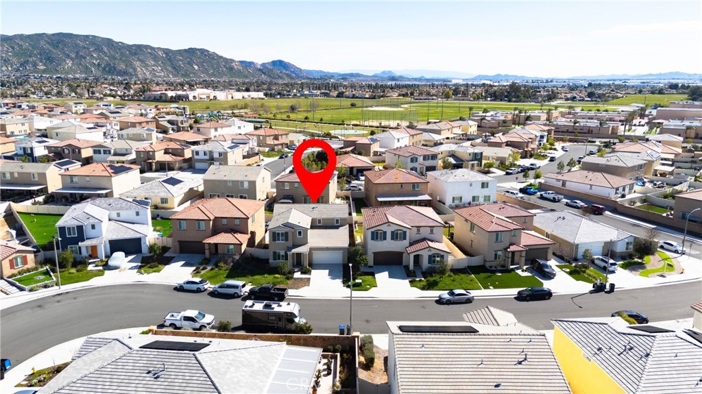 15594 Raptor Road Moreno Valley, CA 92551 - Photo 5 of 53 an aerial view of a houses with a lake view