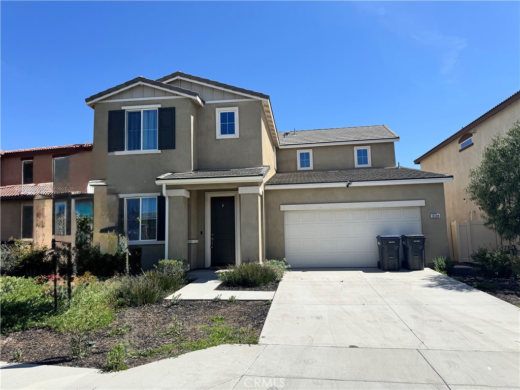 15594 Raptor Road Moreno Valley, CA 92551 - Photo 53 of 53 a front view of a house with a yard