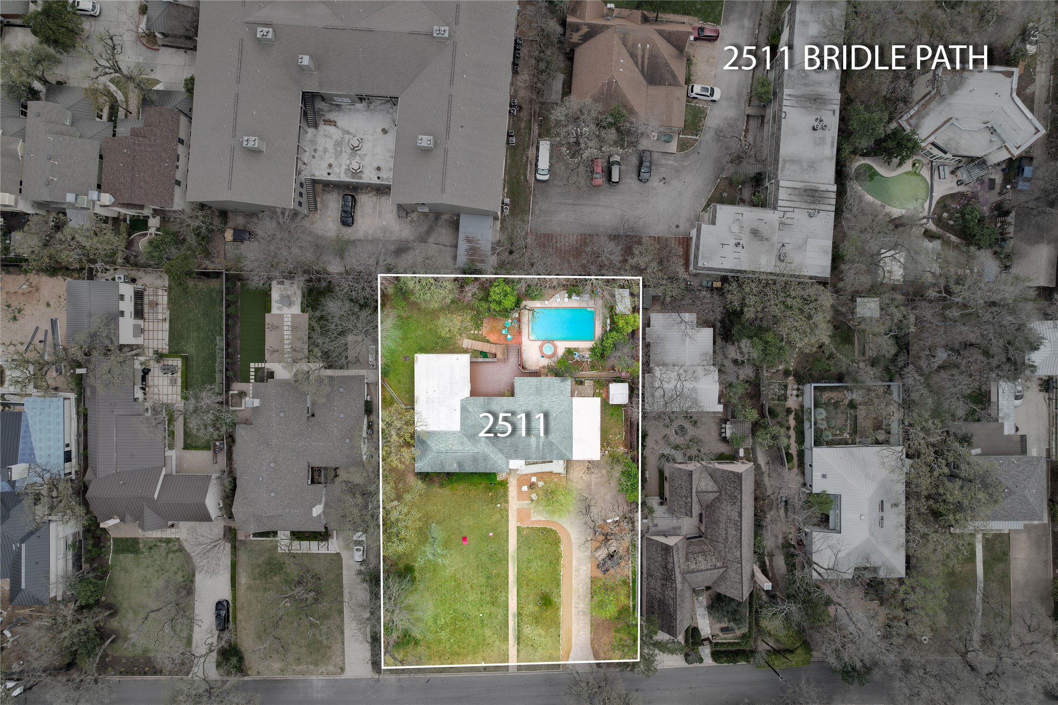 an aerial view of residential houses with outdoor space