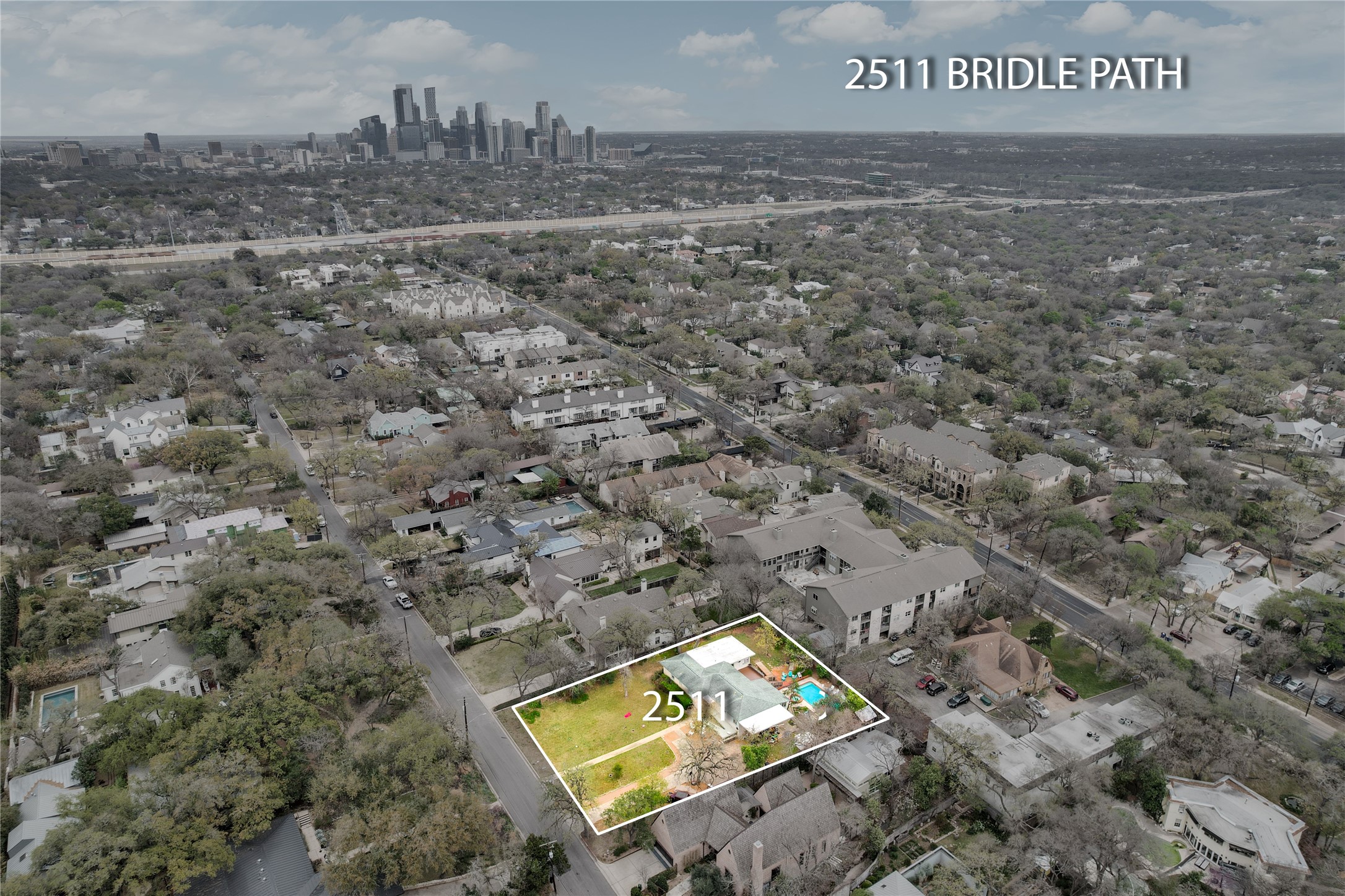 2511 Bridle Path Austin, TX 78703 - Photo 5 of 6 a view of a field with a trees in the background