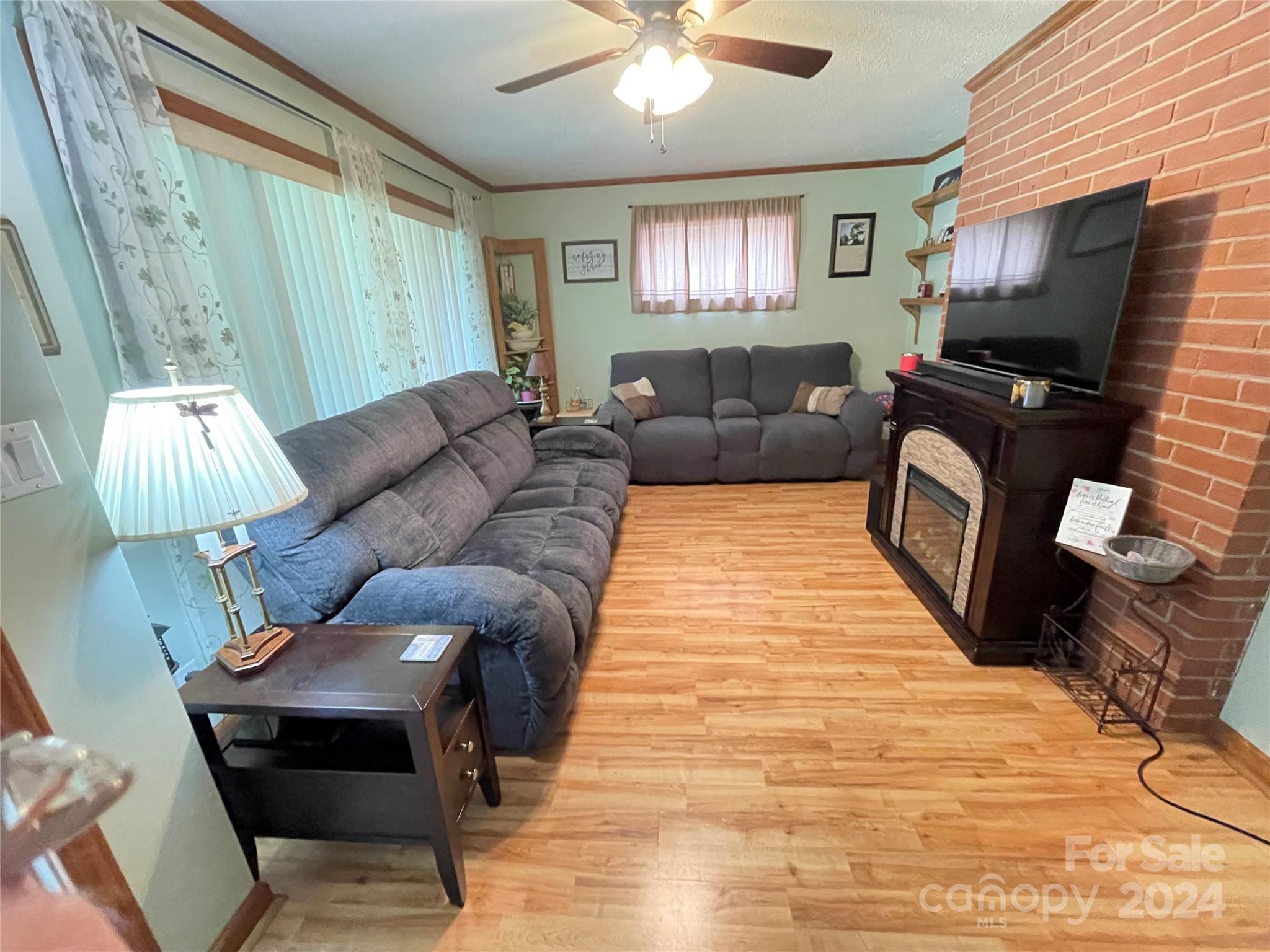 3063 Rocky Road Lenoir, NC 28645 - Photo 3 of 11 a living room with furniture and a flat screen tv