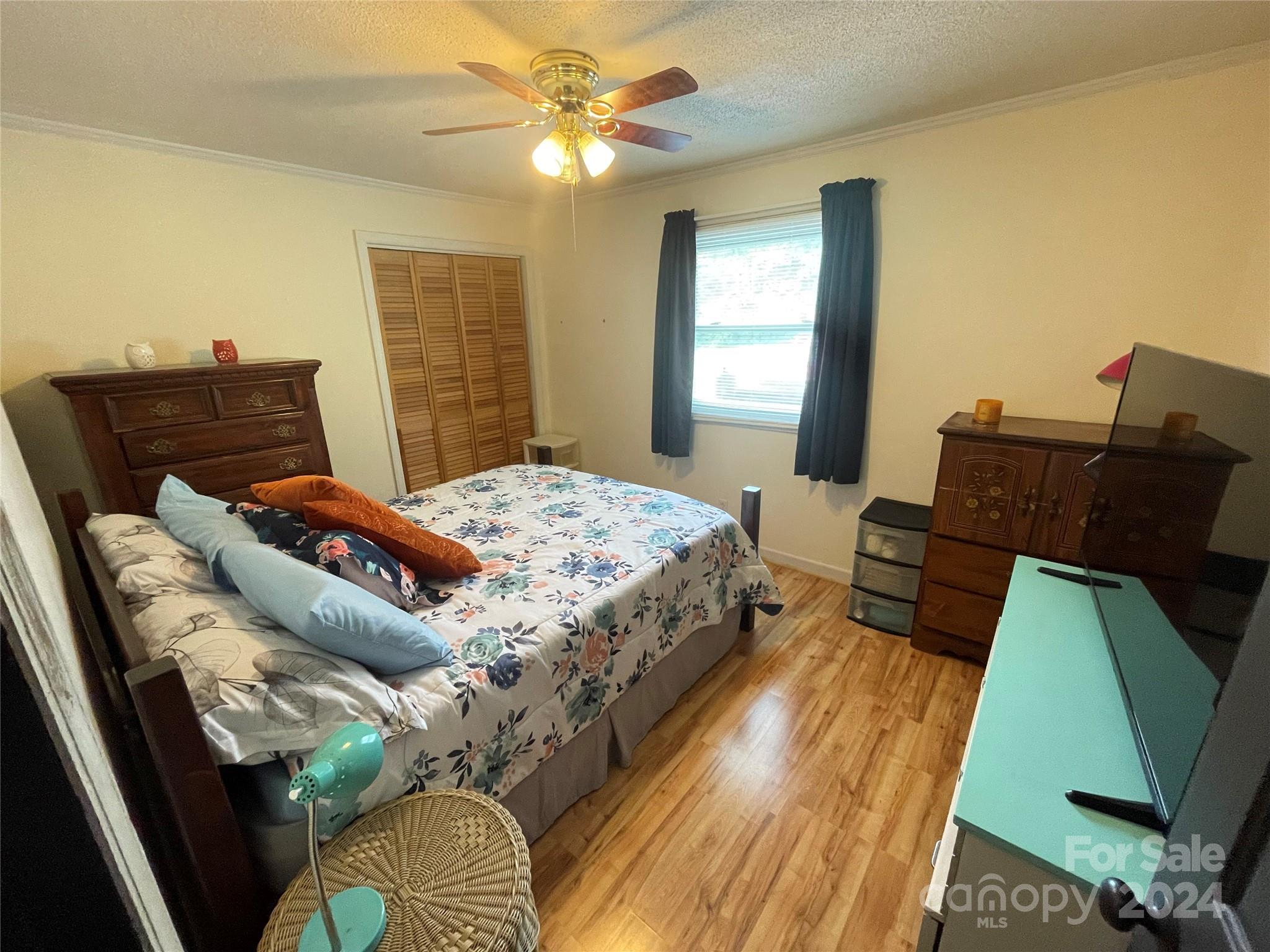 3063 Rocky Road Lenoir, NC 28645 - Photo 5 of 11 a bedroom with a bed and window