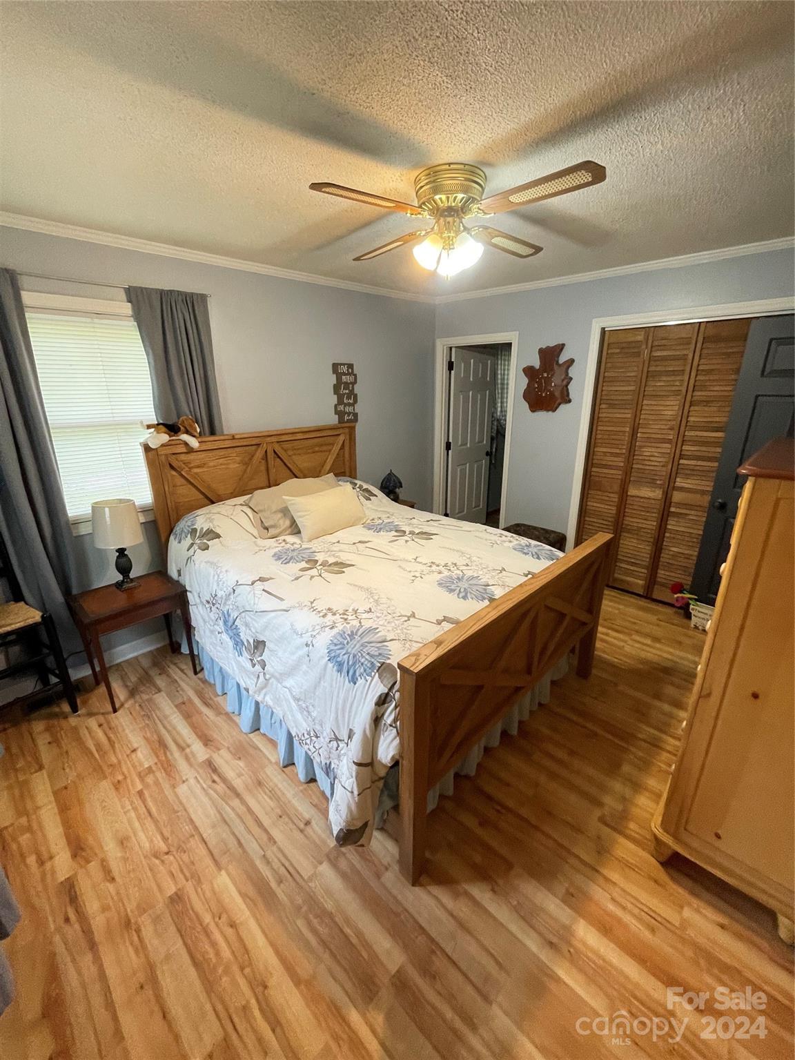 3063 Rocky Road Lenoir, NC 28645 - Photo 9 of 11 a bed sitting in a spacious bedroom next to a window
