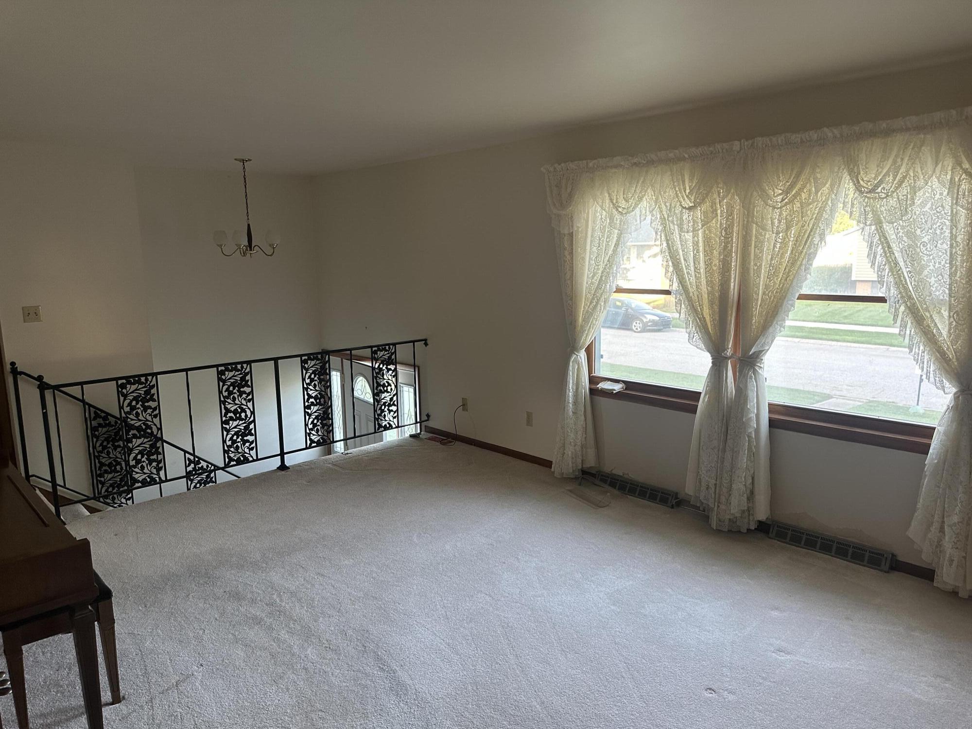 240 Rush Court Hobart, IN 46342 - Photo 2 of 19 an empty room with windows
