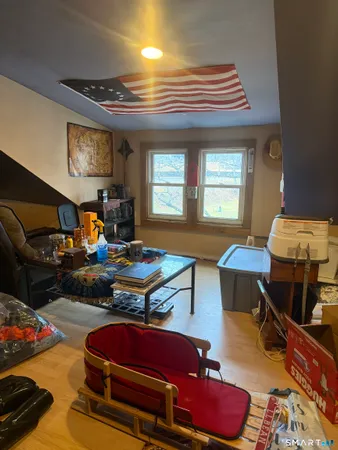 a room with furniture and a wooden floor