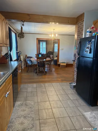 a lobby with furniture and a mirror