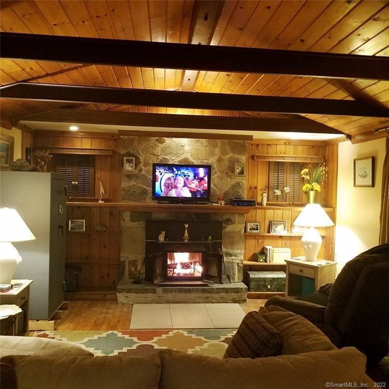 15 Putnam Road Plainfield, CT 06332 - Photo 1 of 1 a living room with furniture and a fireplace