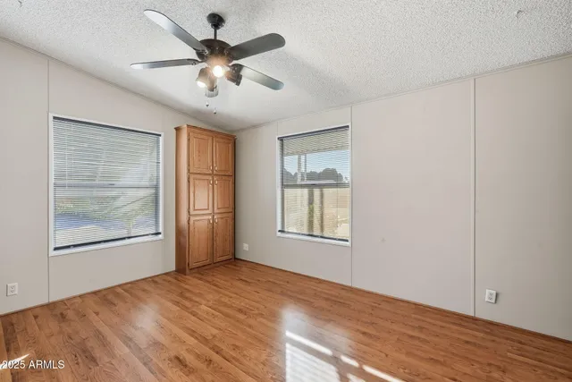 a view of an empty room and wooden floor