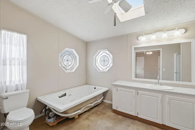 a room with a clock on the wall and a window