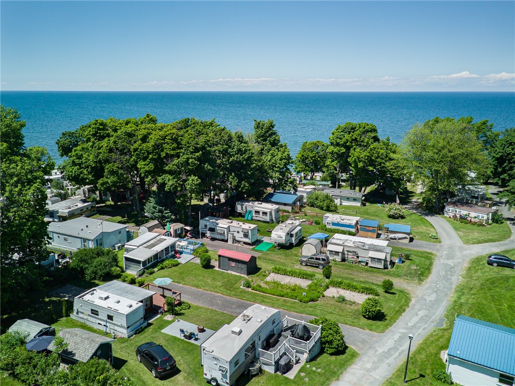 7945 Lake Road, Unit 149 Sodus Point, NY 14555 - Photo 1 of 1 TWO CONCRETE PADS - side by side for a large lot to enjoy!