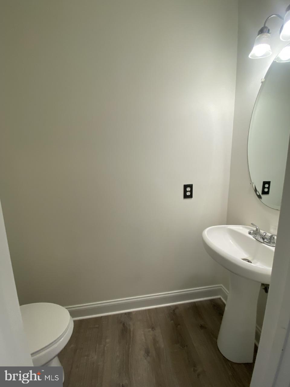 30 White Birch Boulevard Bear, DE 19701 - Photo 11 of 24 a bathroom with a sink mirror and toilet