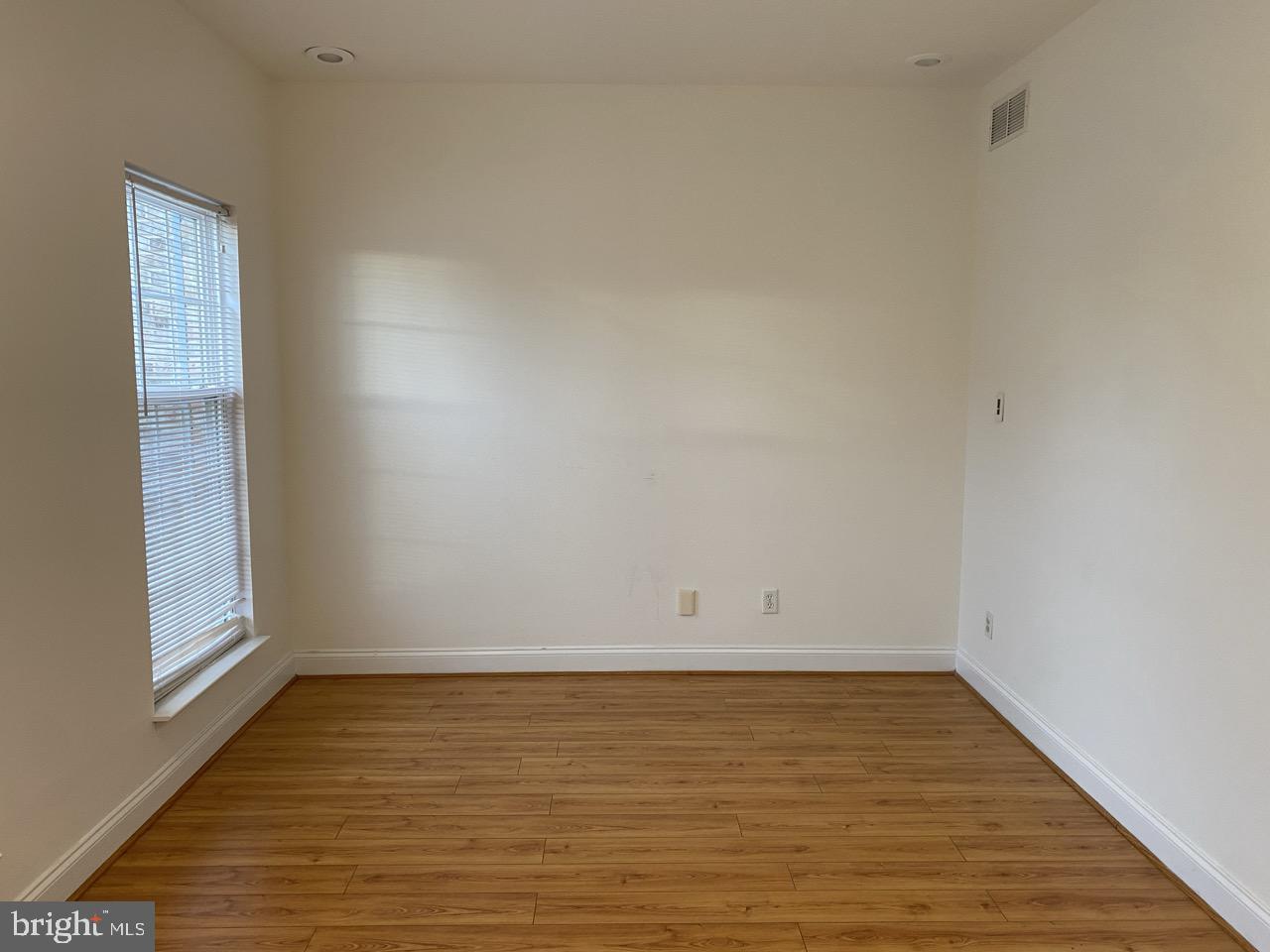 30 White Birch Boulevard Bear, DE 19701 - Photo 4 of 24 a view of an empty room with wooden floor and a window