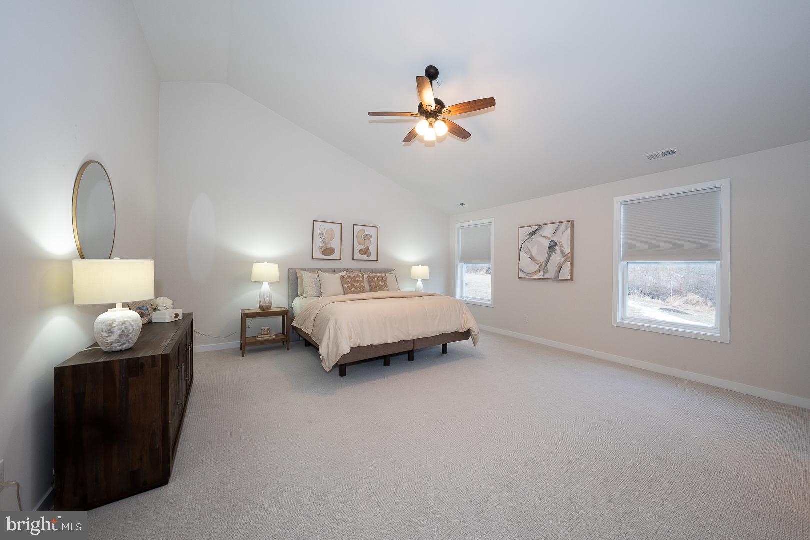 724 Switchman Road Media, PA 19063 - Photo 30 of 70 a bedroom with a bed and a chandelier