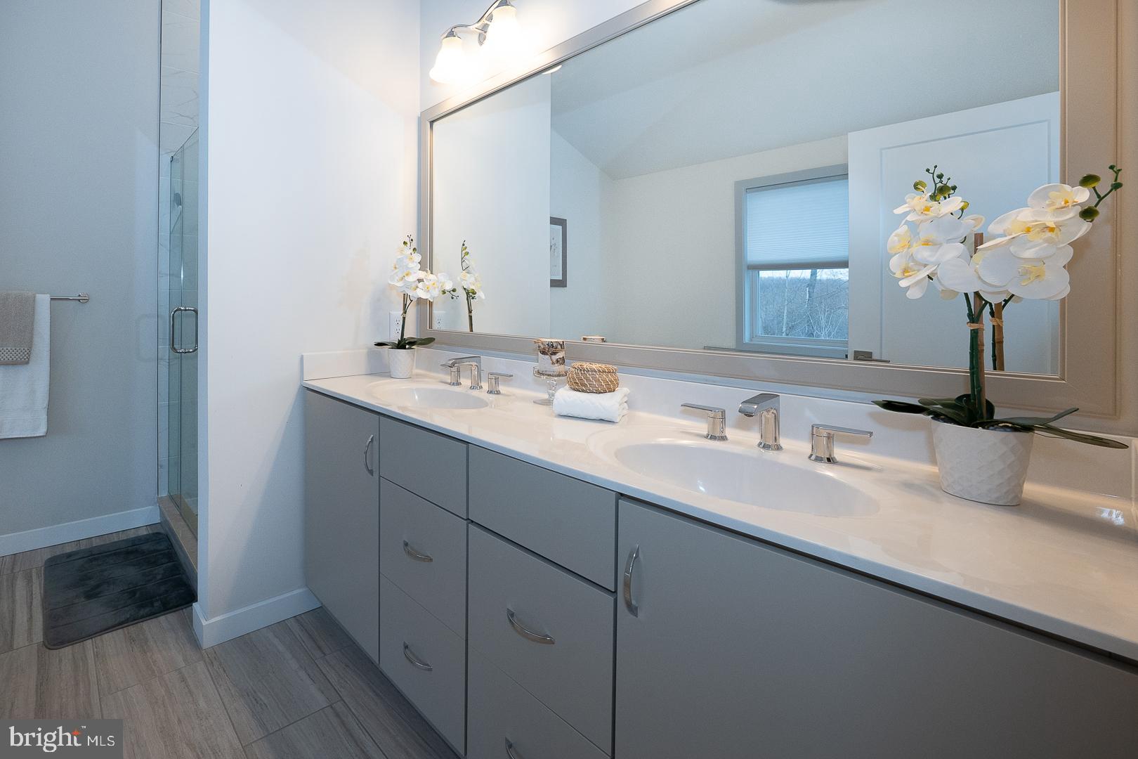 724 Switchman Road Media, PA 19063 - Photo 36 of 70 a bathroom with a sink a vanity and a mirror