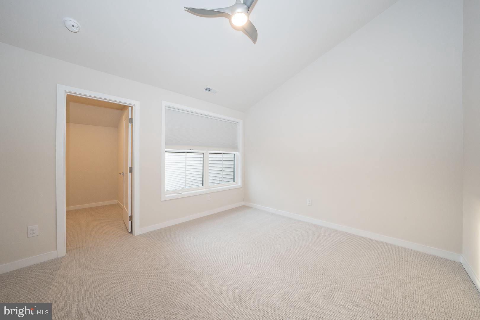 724 Switchman Road Media, PA 19063 - Photo 41 of 70 an empty room with a ceiling fan and window