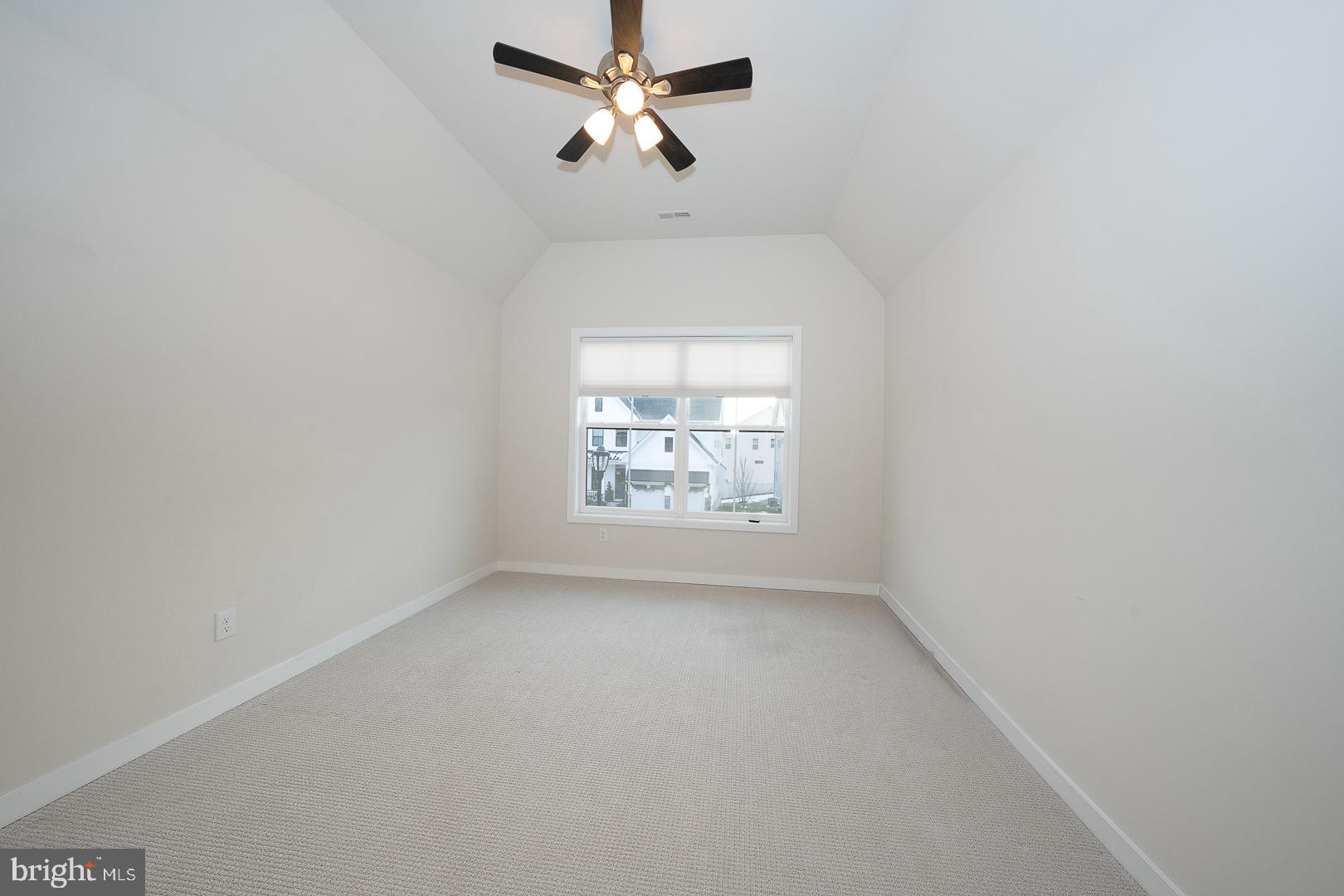 724 Switchman Road Media, PA 19063 - Photo 43 of 70 an empty room with a window and a fan