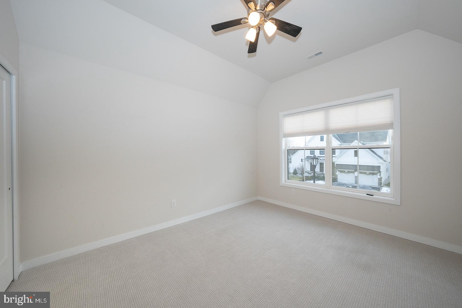 724 Switchman Road Media, PA 19063 - Photo 44 of 70 an empty room with chandelier fan and windows