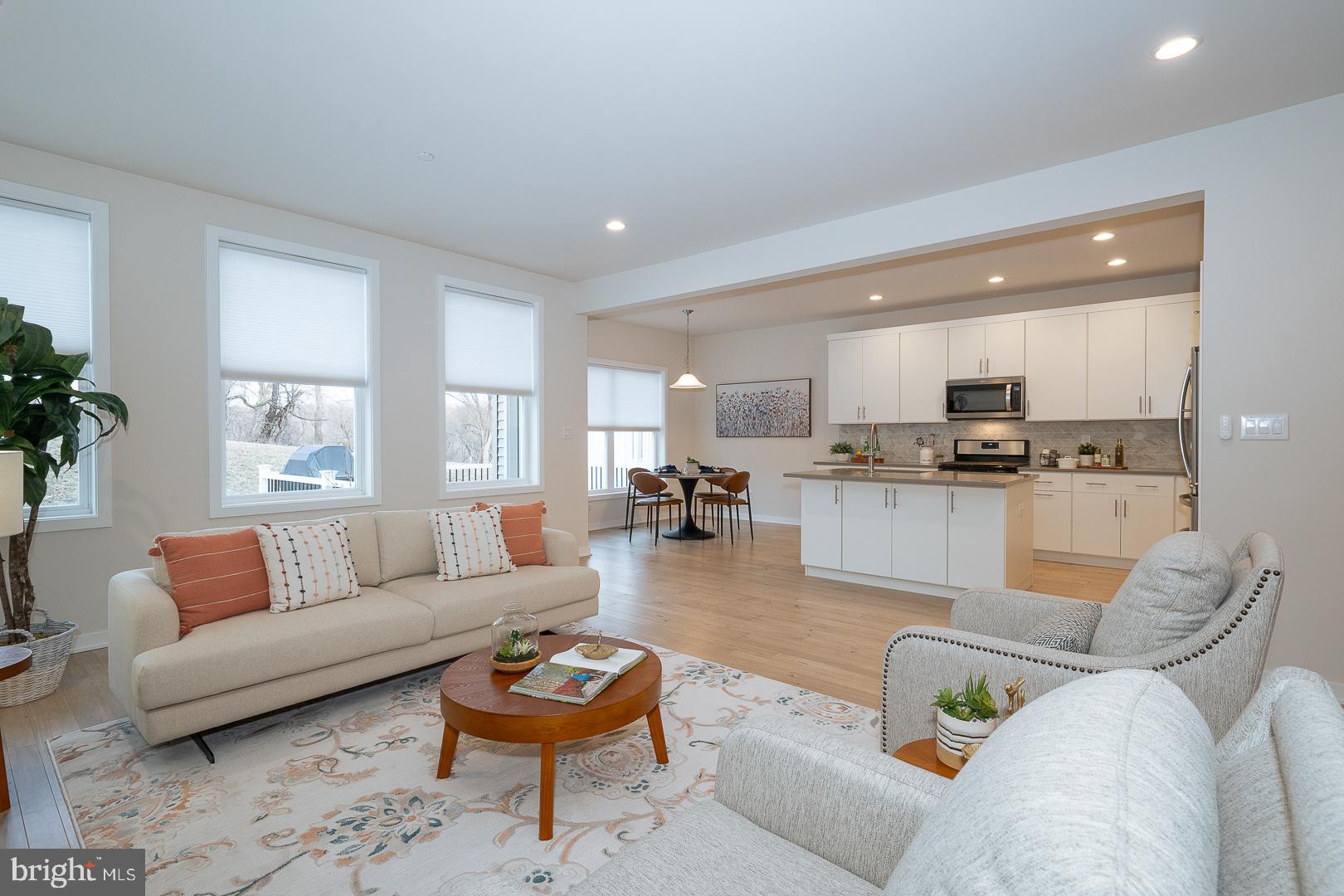 724 Switchman Road Media, PA 19063 - Photo 10 of 70 a living room with furniture and kitchen view