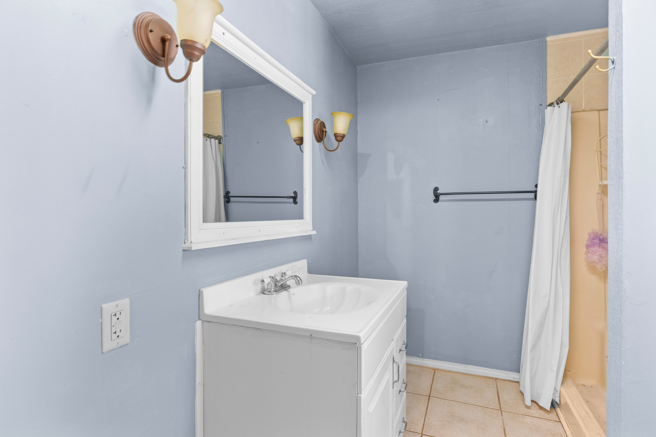 147 Community Center Road Rosanky, TX 78953 - Photo 19 of 33 Full bath with a stall shower, vanity, and light tile patterned floors