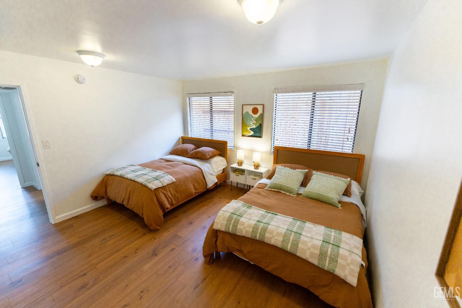 Undisclosed Address Bakersfield, CA 93306 - Photo 13 of 20 a bedroom with two beds and a window