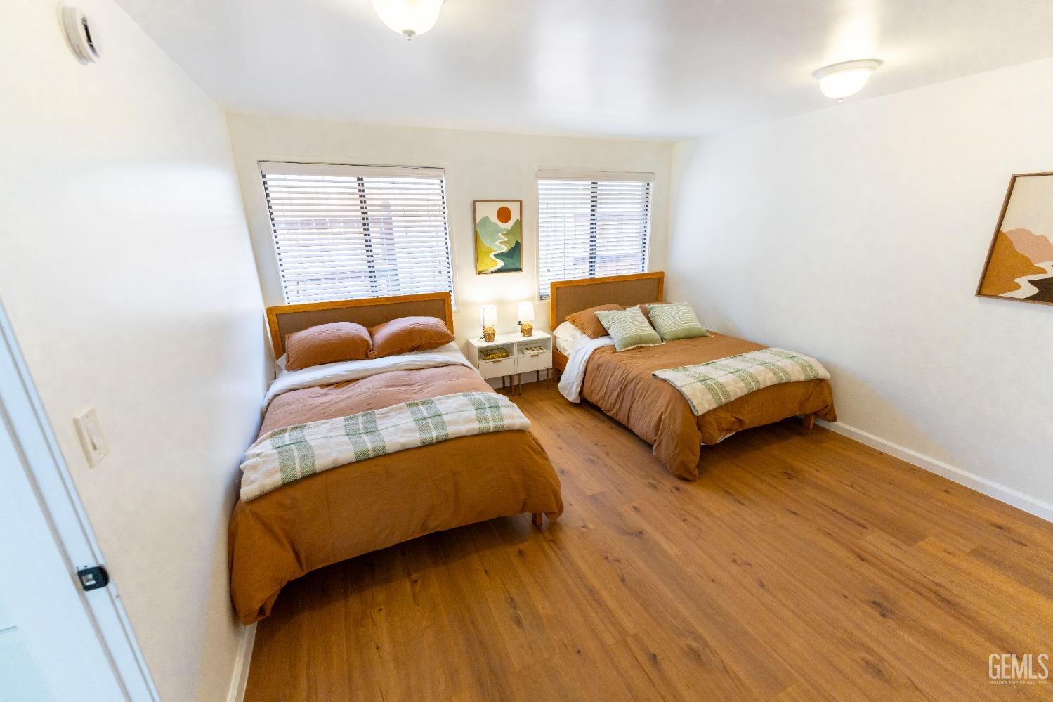 Undisclosed Address Bakersfield, CA 93306 - Photo 14 of 20 a bedroom with two beds and a window