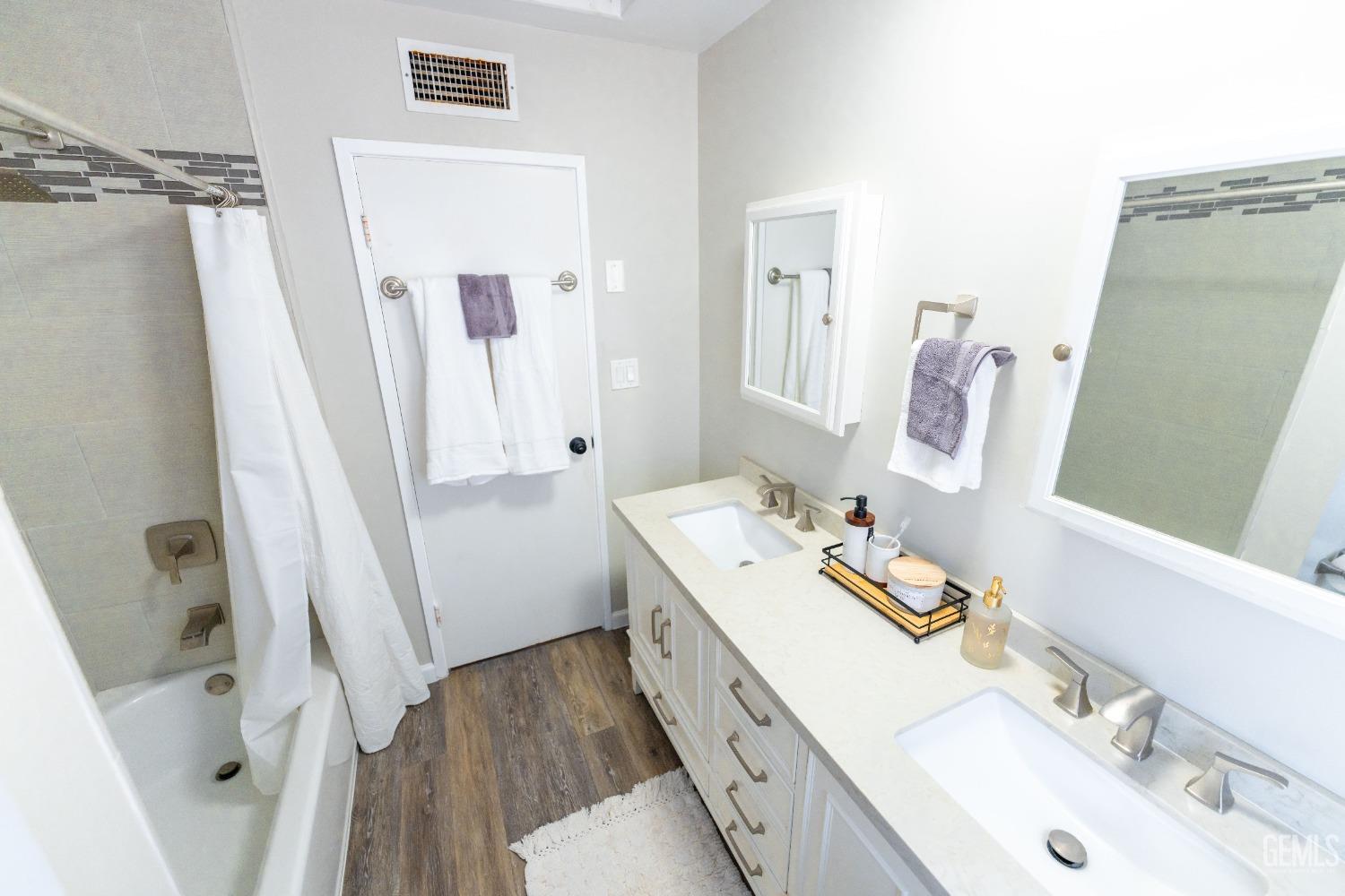 Undisclosed Address Bakersfield, CA 93306 - Photo 16 of 20 a bathroom with a sink a tub and shower