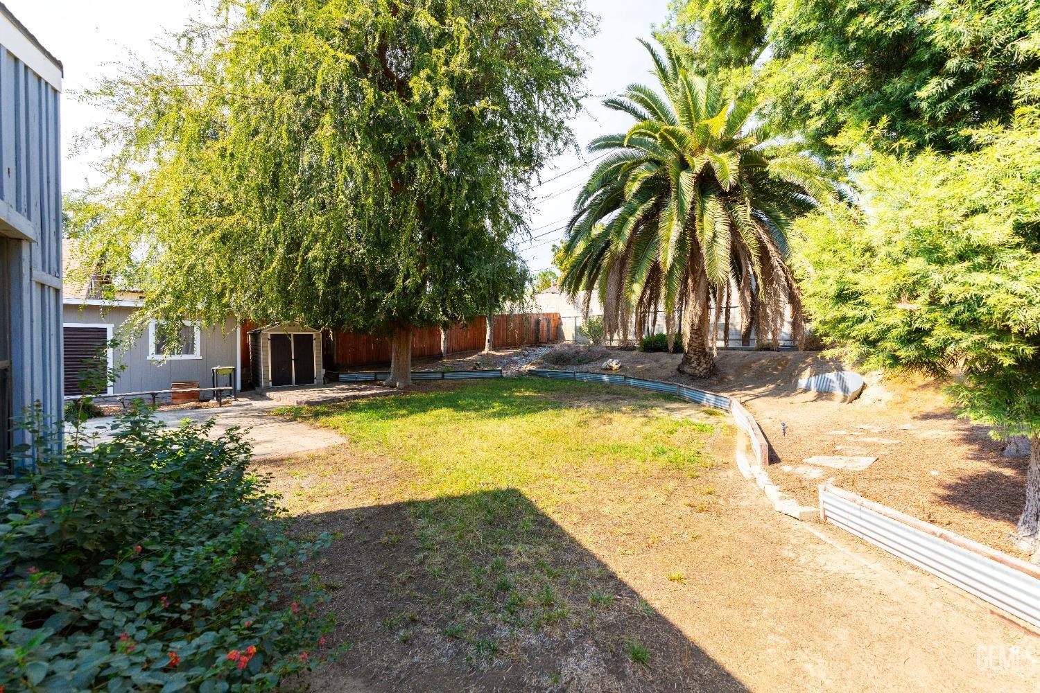 Undisclosed Address Bakersfield, CA 93306 - Photo 18 of 20 a house with swimming pool in front of it