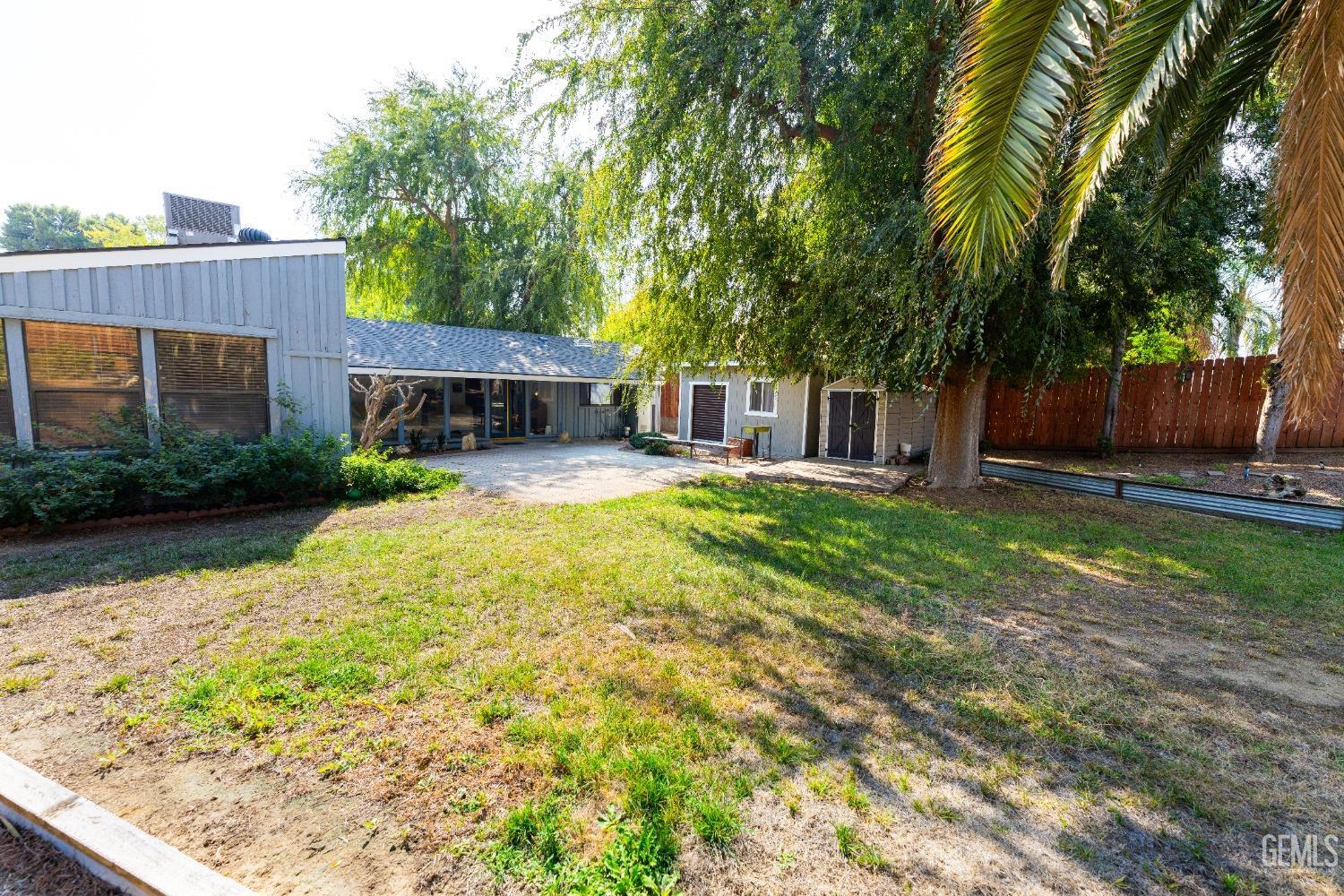 Undisclosed Address Bakersfield, CA 93306 - Photo 19 of 20 a view of a house with backyard and sitting area