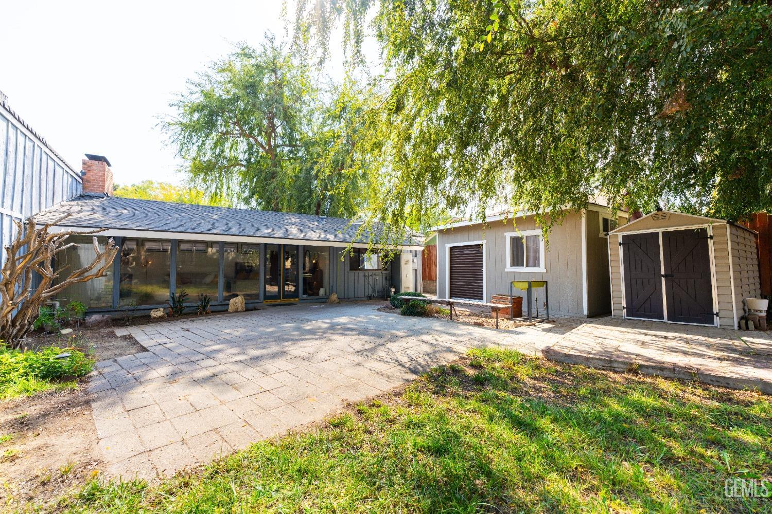 Undisclosed Address Bakersfield, CA 93306 - Photo 20 of 20 a view of a house with a yard and tree