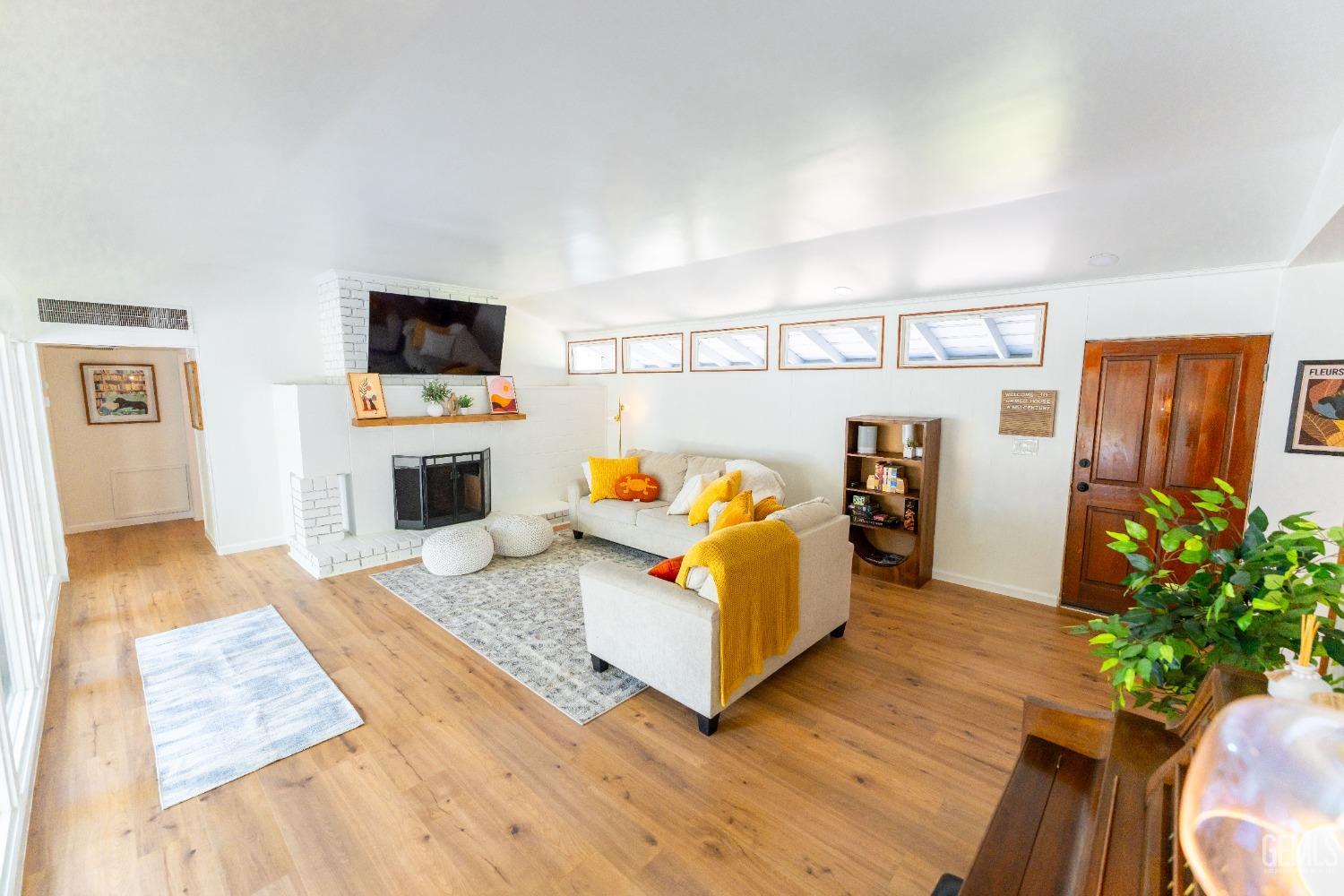 Undisclosed Address Bakersfield, CA 93306 - Photo 4 of 20 a living room with furniture and a flat screen tv