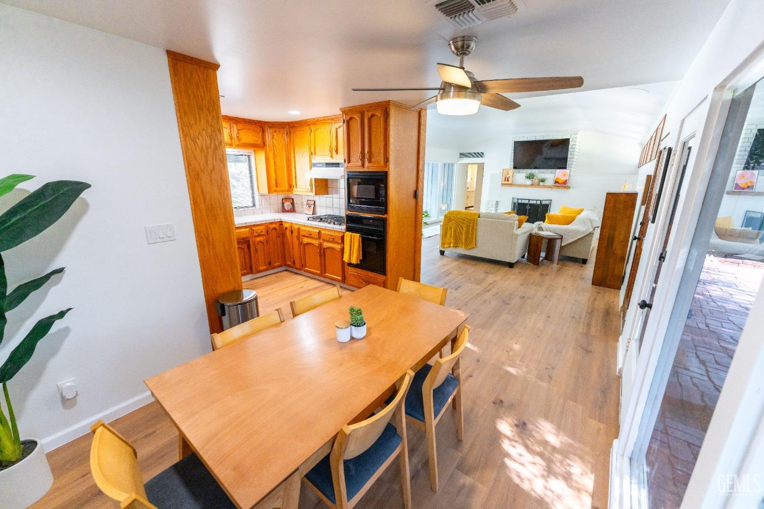 Undisclosed Address Bakersfield, CA 93306 - Photo 7 of 20 a living room with furniture and a flat screen tv