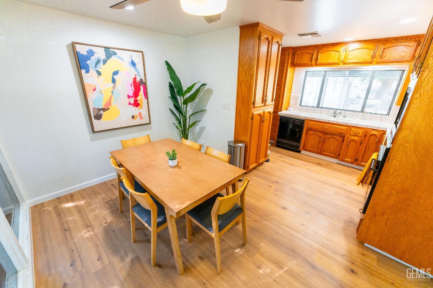 Undisclosed Address Bakersfield, CA 93306 - Photo 8 of 20 a view of a dining room with furniture and a large window