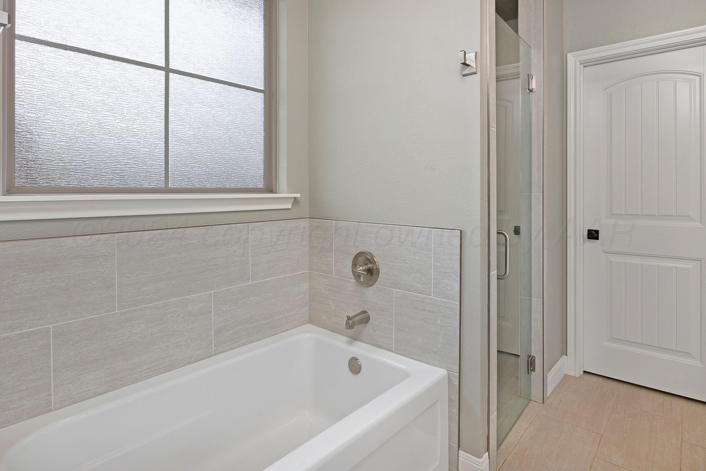 17200 Stone Creek Road Amarillo, TX 79124 - Photo 14 of 32 016_Primary Bath and Shower