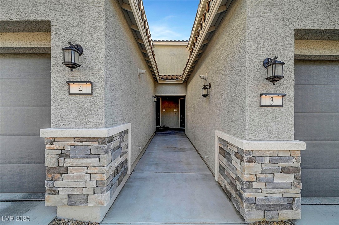7204 North Decatur Boulevard North Las Vegas, NV 89084 - Photo 6 of 55 Property entrance with stucco siding