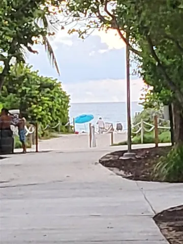 a front view of a house with a garden and patio