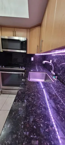 a bathroom with a sink and a stove