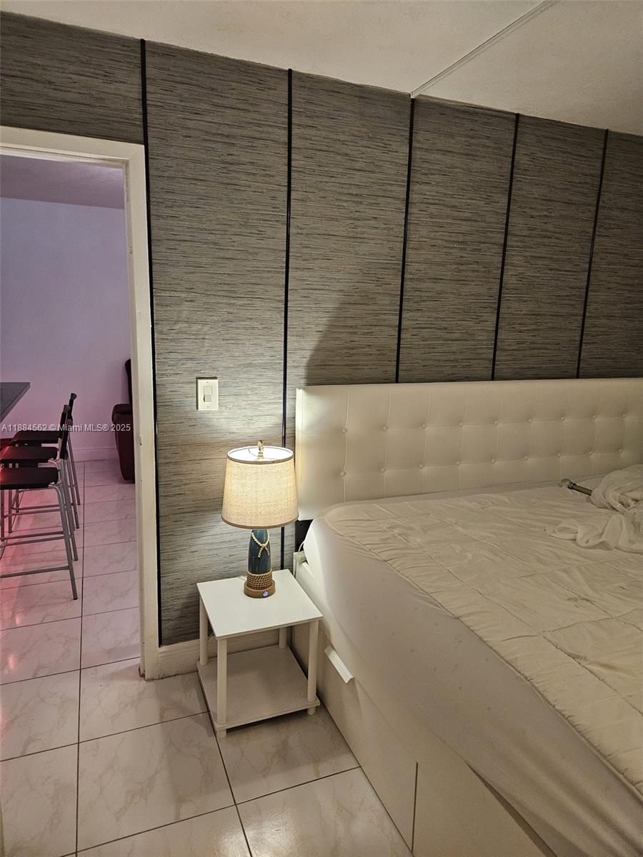 8425 Harding Avenue, Unit 1 Miami Beach, FL 33141 - Photo 9 of 16 a outdoor space with a couch