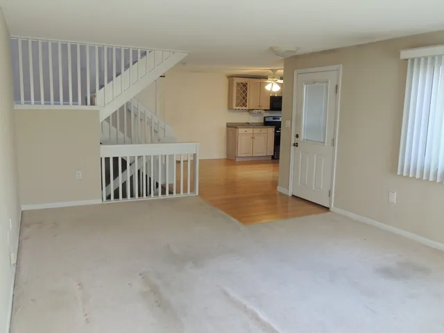 a view of livingroom with furniture and staircase