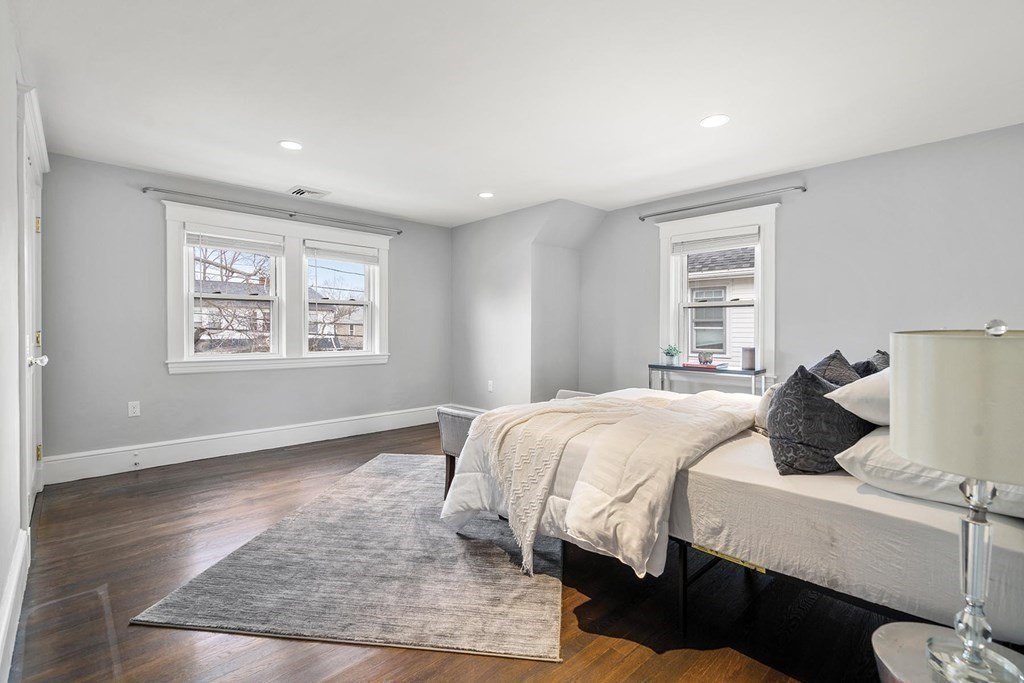 70 Falmouth Road Newton, MA 02465 - Photo 14 of 29 a bedroom with a bed and wooden floor