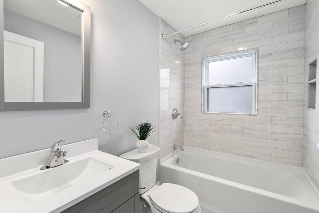 70 Falmouth Road Newton, MA 02465 - Photo 15 of 29 a bathroom with a sink toilet and bathtub