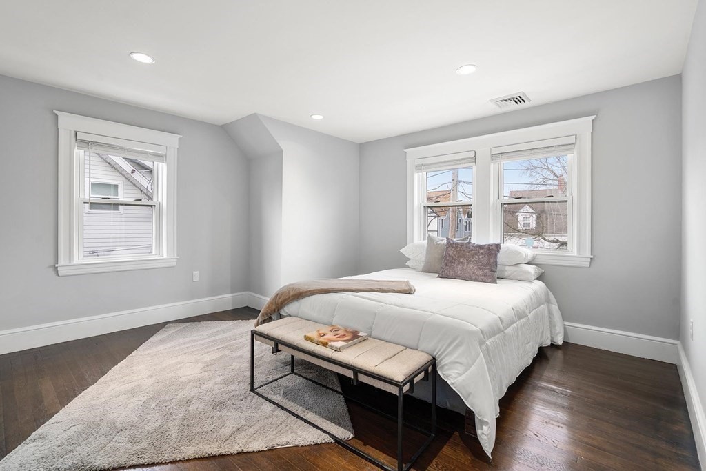 70 Falmouth Road Newton, MA 02465 - Photo 16 of 29 a bedroom with a bed table and window