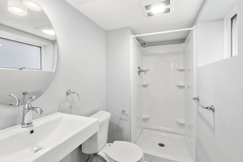 70 Falmouth Road Newton, MA 02465 - Photo 21 of 29 a bathroom with a sink toilet and shower