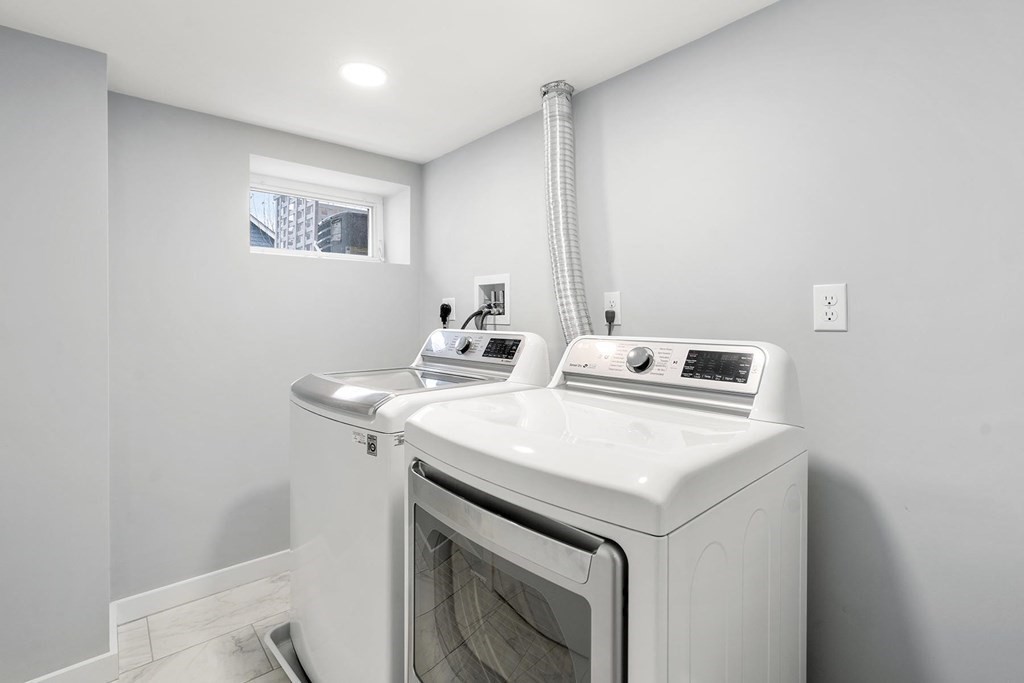 70 Falmouth Road Newton, MA 02465 - Photo 22 of 29 a utility room with washer and dryer