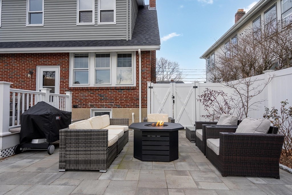 70 Falmouth Road Newton, MA 02465 - Photo 24 of 29 a brick building with a bench in front of it