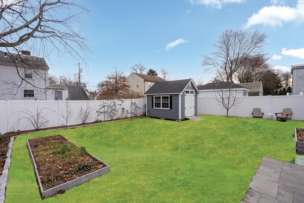 70 Falmouth Road Newton, MA 02465 - Photo 28 of 29 a view of a backyard with a garden and plants